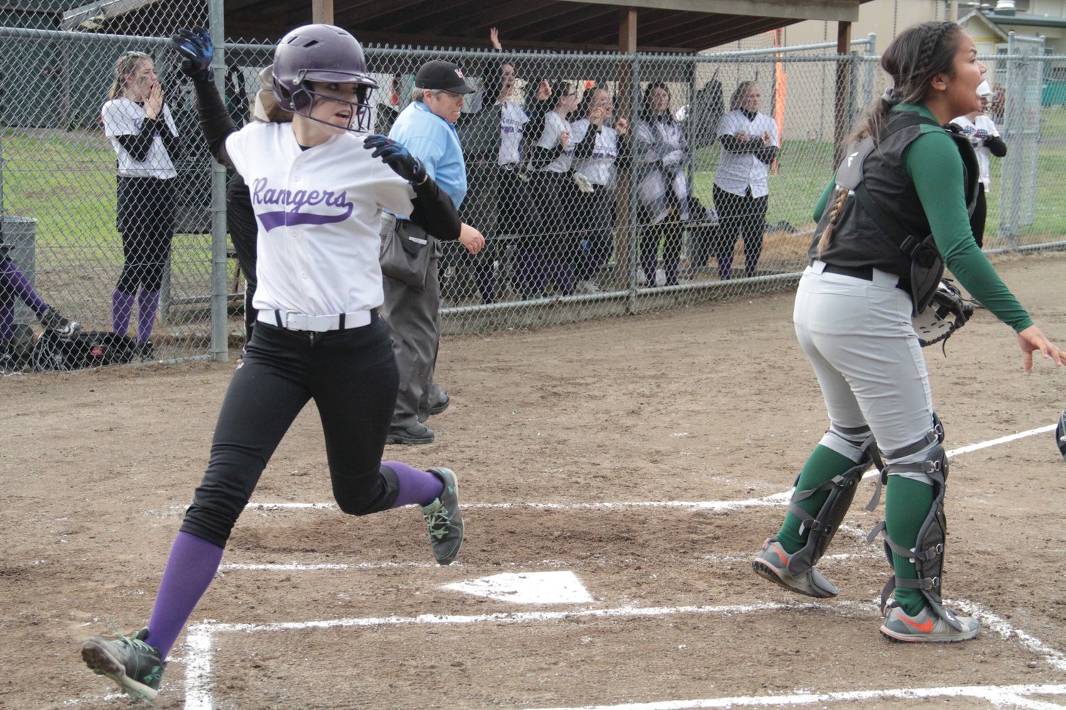 Abby Ward crosses home plate for the Rangers during Quilcene’s win over the Muckleshoot Kings at home in Quilcene.